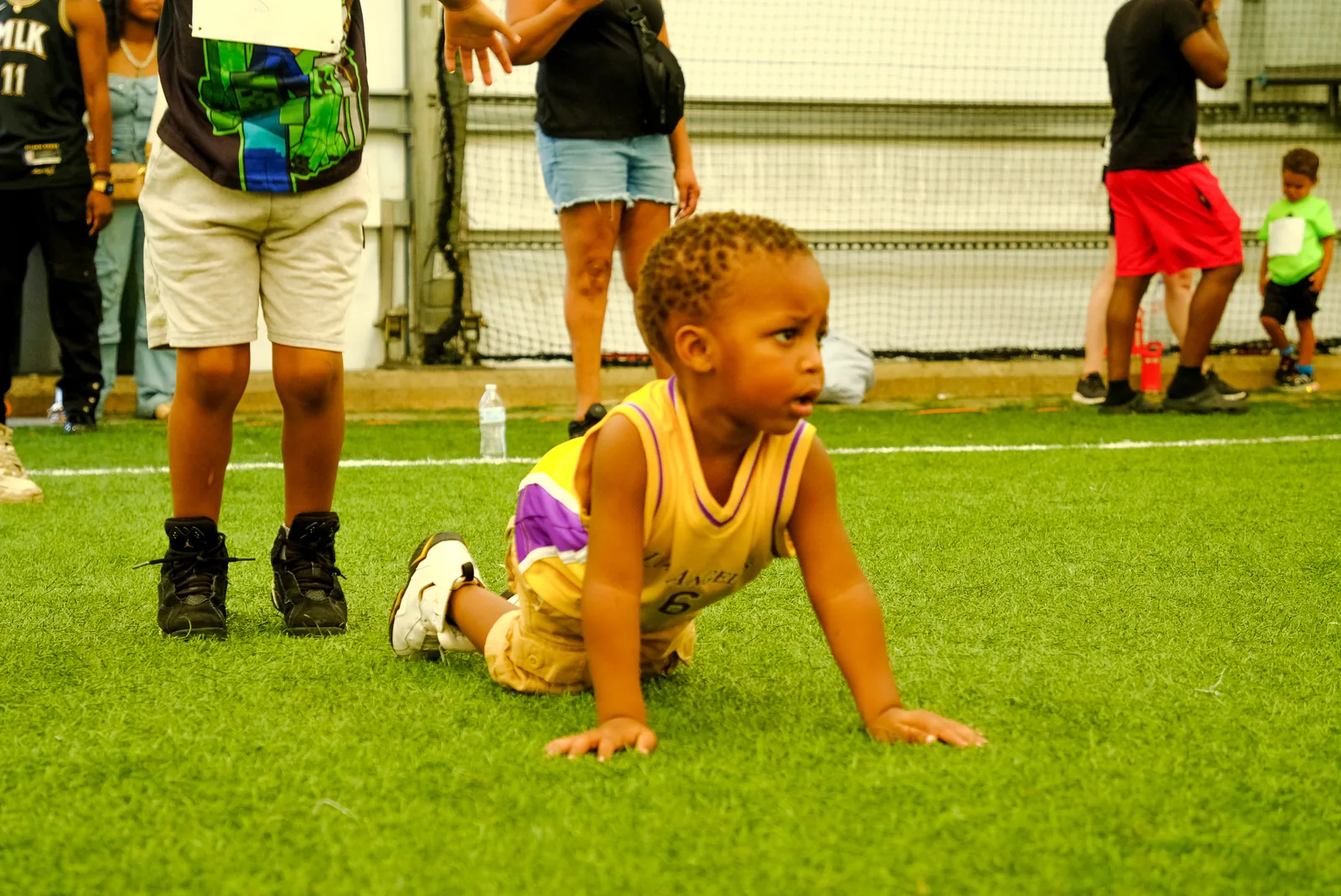 Toddlers taking part in a gross-motor movement activity