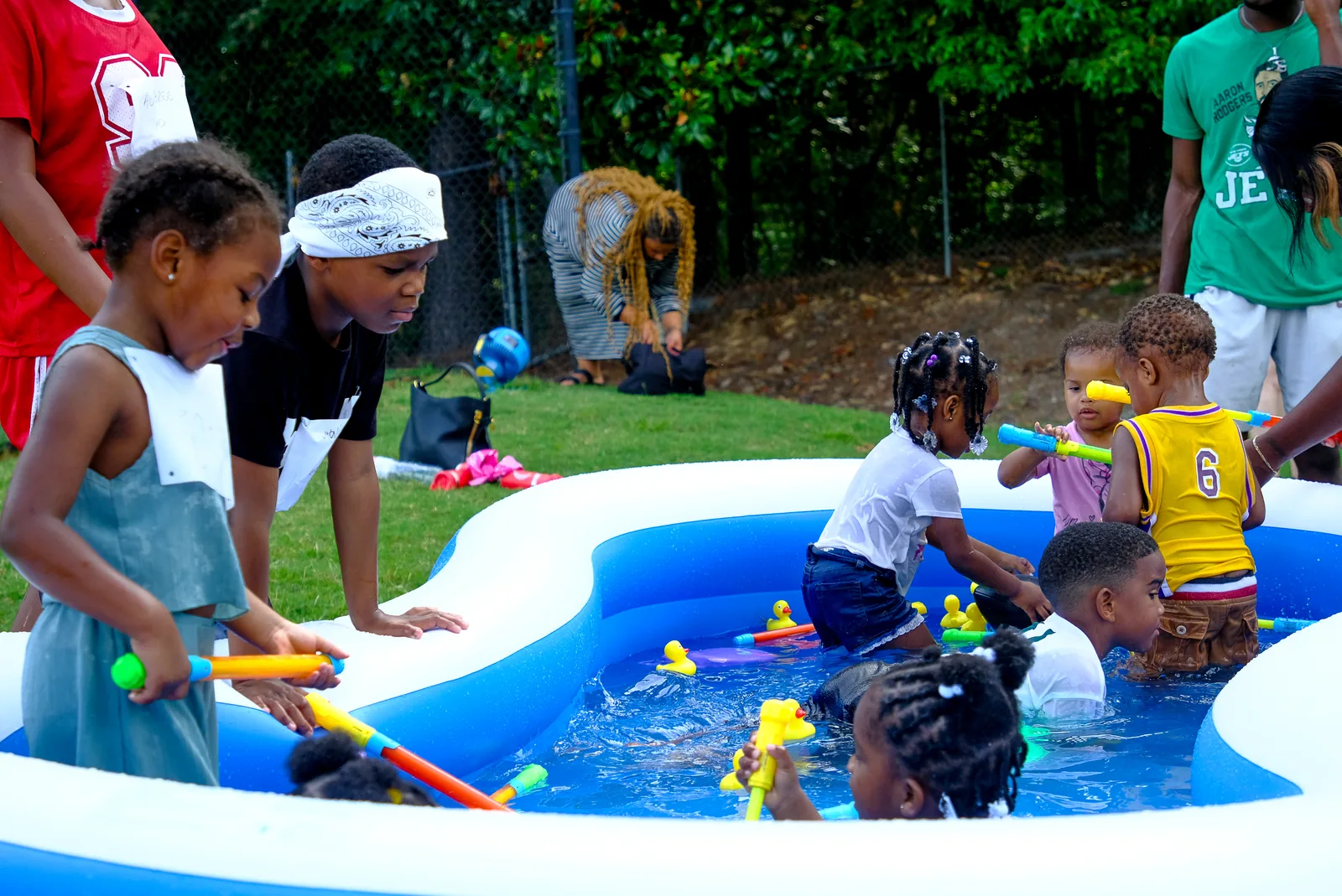 Students cooling off during a high-energy Faith First Fitness field day